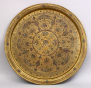 A LARGE 19TH CENTURY SYRIAN BRASS INLAID CALLIGRAPHIC TRAY, inlaid with calligraphy 70cm.