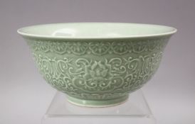 A GOOD CHINESE KANGXI STYLE CELADON CARVED PORCELAIN BOWL, The exterior carved with formal