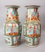A OOD PAIR OF 19TH CENTURY CHINESE CANTON FAMILLE ROSE PORCELAIN VASES, each with panel decoration