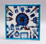 A GOOD IZNIK POTTERY KABE TILE, the tile decorated with an buildings and calligraphy, 21cm.