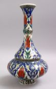 AN ISLAMIC PALESTINIAN POTTERY WATER URN, decorated with floral decoration, 31cm