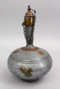 A 19TH CENTURY INDIAN BRASS INLAID PEWTER DRINKING FLASK 