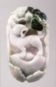 A CHINESE CARVED JADIEITE PENDANT OF A TIGER AND MONEY IN A LANDSCAPE, 8.5CM.