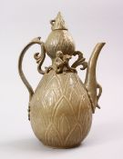 A CHINESE SONG STYLE CELADON TEAPOT & COVER, with moulded decoration of figures and flora, 29cm