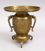 A CHINESE 19TH / 20TH CENTURY ARCHAIC DESIGN BRONZE CENSER, with twin handles and tri feet, 18cm.
