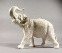 A LARGE BESWICK WHITE POTTERY ELEPHANT. 14ins long.