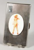 A LARGE ENGINE TURNED SILVER CIGARETTE CASE with an oval enamel plaque GLAMOUR. Birmingham 1921.