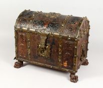 A 19TH / 20TH CENTURY CONTINENTAL BRASS BOUND AND EMBOSSED LEATHER DOME TOP CABINET, in Medieval