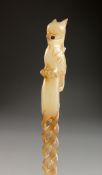 A CHINESE CARVED JADE HAIRPIN. 9.5ins long.
