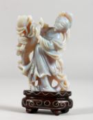 AN UNUSUAL CHINESE CARVED OPAL FIGURE OF A LADY ON A STAND. Figure 2.5ins high.