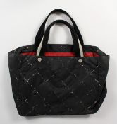 A CHANEL FABRIC BAG.