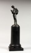 A SMALL BRONZE OF NARCISSUS. 4.5ins high, on a wooden plinth, 9.5ins overall