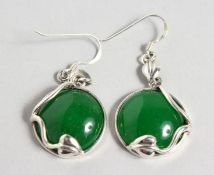 A PAIR OF SILVER AND JADE EARRINGS. 0.75ins diameter.