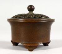 A SMALL CHINESE CIRCULAR BRONZE CENSER.