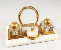 A RARE HORSE RACING AGATE AND METAL TWO BOTTLE TABLE INKSTAND, the bottles with Jockey Cap covers,