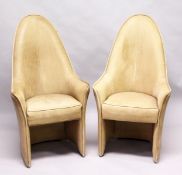 AN UNUSUAL PAIR OF LEATHER UPHOLSTERED HIGH BACK ARMCHAIRS, mid 20th Century. 3ft 11ins high x 2ft