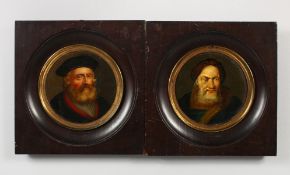 A PAIR OF CONTINENTAL PORTRAIT BUSTS BEARDED GENTLEMEN, oil on board, circular, in ebony frames.