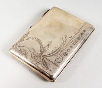 A RUSSIAN SILVER CIGARETTE CASE, with engraved decoration and cabochon ruby thumb piece. 4.75ins x