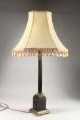 A BRASS CORINTHIAN COLUMN TABLE LAMP, with cream shade. Lamp 22ins high.