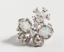 A SILVER RING set with opals.