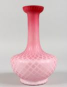 A PINK OPAQUE GLASS VASE, with interlaced design. 8ins high.