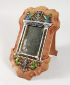 A CHAMPLEVE ENAMEL MIRROR on a velvet background. 11ins long.