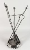A GOOD SET OF POLISHED STEEL FIRE IRONS AND STAND.