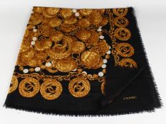 A VINTAGE CHANEL SILK SCARF, BLUE WITH GOLD CHANEL EMBLEM.