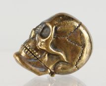 A BRASS SKULL SHAPE VESTA CASE.
