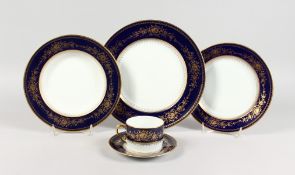 A COMPREHENSIVE LIMOGES PORCELAIN DINNER SERVICE, white ground with gilt decorated border,