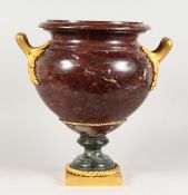 A SUPERB LOUIS XVITH ROUGE MARBLE TWO HANDLED URNS with ormolu handles, rope work and square base.