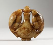 A CARVED JADE ROUNDEL. 2ins wide.
