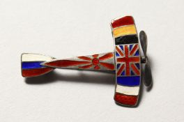 A RARE MILITARY ENAMEL DECORATED ALLIES AEROPLANE BROOCH. 1.5ins diameter.