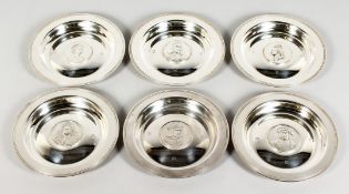 A SET OF SIX SILVER CIRCULAR DISHES, ROYAL LINEAGE SET, each 5ins diameter. London 1973. Weight