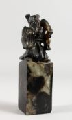 A CARVED FIGURAL SOAPSTONE SEAL. 4.5ins high.