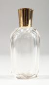 AN 18CT GOLD MOUNTED CUT GLASS SCENT BOTTLE. 3.25ins high.