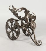 A GOOD SILVER PLATED CAST METAL TWO WHEELED CARRIAGE STYLE WINE BOTTLE POURER. 12ins long.