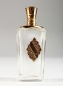AN 18CT GOLD MOUNTED CUT GLASS SCENT BOTTLE. 3.5ins high.