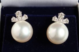 A PAIR OF 18CT WHITE GOLD, PEARL AND DIAMOND EARRINGS.