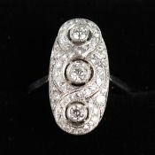 A SUPERB PLATINUM AND DIAMOND SET RING set with three diamonds and diamonds in the form of a