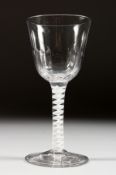A LARGE GEORGIAN WINE GLASS with semi fluted bowl and white air twist stem. 6ins high.