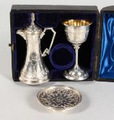 A VICTORIAN ENGRAVCED THREE PIECE COMMUNION SET in a blue velvet lined box. Birmingham 1890.