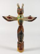 A CARVED OAK AND PAINTED FOLK ART THUNDERBIRD TOTEM POLE. 10ins long.
