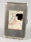 A LARGE ENGINE TURNED SILVER CIGARETTE CASE with an oval enamel plaque GLAMOUR. Birmingham 1950,