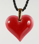 A RED LALIQUE HEART PENDANT.