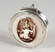A CIRCULAR SILVER JEWELLERY BOX with erotic oval panel. Birmingham 1918.