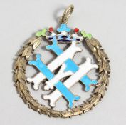 A RUSSIAN SILVER GILT AND ENAMEL DECORATED MONOGRAMMED PENDANT. 1.75ins diameter.