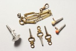 SIX WATCH KEYS AND A CHAIN.