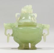 A CARVED JADE LIDDED TRIPOD KORO, with kylin handles. 5.5ins wide.