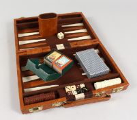 A LEATHER CASED BACKGAMMON SET.